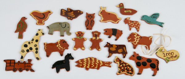 Lester Breininger, 22 Folk Art Christmas Ornaments: Lester Breininger (American, 20th Century) Collection of twenty-two Pennsylvania German Glazed Redware Christmas Ornaments, ranging in size from 2-1/2 x 3-1/4 to 3-1/2 x 5-1/2 inches. Provenance: The