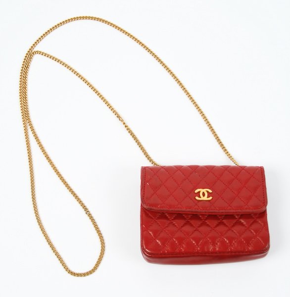 Chanel Mini Red Quilted Leather Change Purse: Chanel Mini Red Quilted Leather Change Purse, gold chain and hardware, original storage bag and box, 3 x 4-1/4 x 1 inches. Provenance: The Betty Gordon Estate.