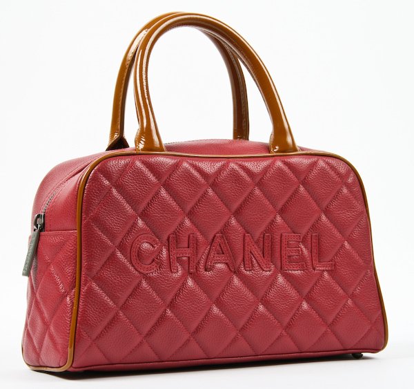 Chanel Cranberry Quilted Bowler Handbag: Chanel Cranberry Quilted Bowler Handbag, brown patent leather handles, original storage bag and box, 6 x 9 x 3-1/2 inches. Provenance: The Betty Gordon Estate.