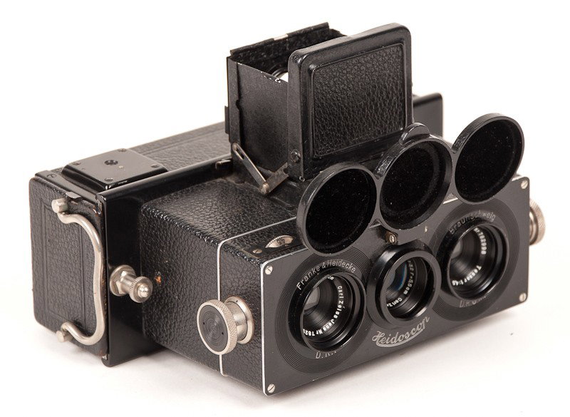 Heidoscop Stereo Roll Film Camera and Accessories: Heidoscop Stereo Camera (Serial No. 70963) with (3) Carl Zeiss Jena Tessar Lenses and Leather Case. Manufactured by Franke & Heidecke in Braunschweig, Germany. Provenance: The Kaprelian Camera Collect