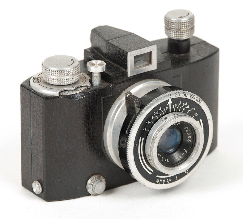 SEM Kim, 35mm Roll Film Viewfinder Camera: SEM Kim, 35mm Roll Film Viewfinder Camera with Cross Lens. Manufactured by SEM in France circa 1947. Provenance: The Kaprelian Camera Collection, Philadelphia, PA.