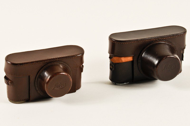 A Pair of Brown Leather Leica Camera Cases: A Pair of Brown Leather Leica Camera Cases. Manufactured by Ernst Leitz in Wetzlar, Germany. Provenance: The Kaprelian Camera Collection, Philadelphia, PA.