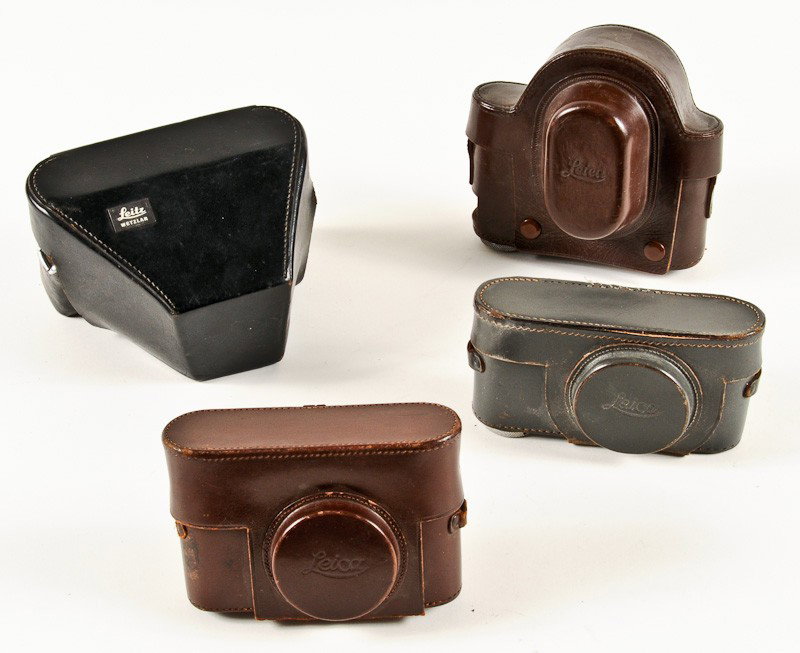Group of 4 Leather Leica Camera Cases: Group of 4 Leather Leica Camera Cases including (2) Brown, Black and Grey. Manufactured by Ernst Leitz in Wetzlar, Germany. Provenance: The Kaprelian Camera Collection, Philadelphia, PA.