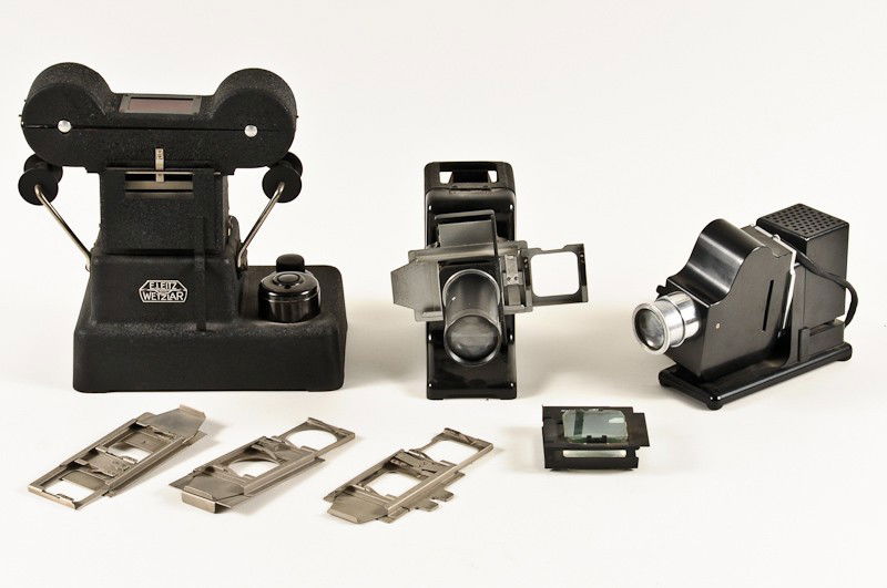 Group of 3 Early Leitz Projectors: Group of 3 Early Leitz Projectors including Parvo with (3) Slide Carriers and Extra Lens Assembly (Power Cord Missing), 35mm Film Strip Projector, 35mm Slide Copier (No Power Cord). Manufactured by Er
