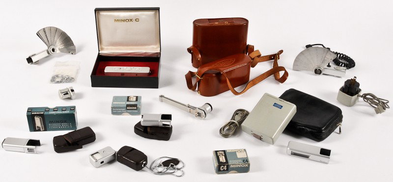 Minox C Camera with Accessories: Minox C Camera (Serial No. 2374650) with Accessories. Including Original Box, Metal Snake Carrying Chain, (2) Right Angle Viewfinders, C4 Flashgun (for FlashCubes), Flashgun Model B (for A G 1 Bulbs),