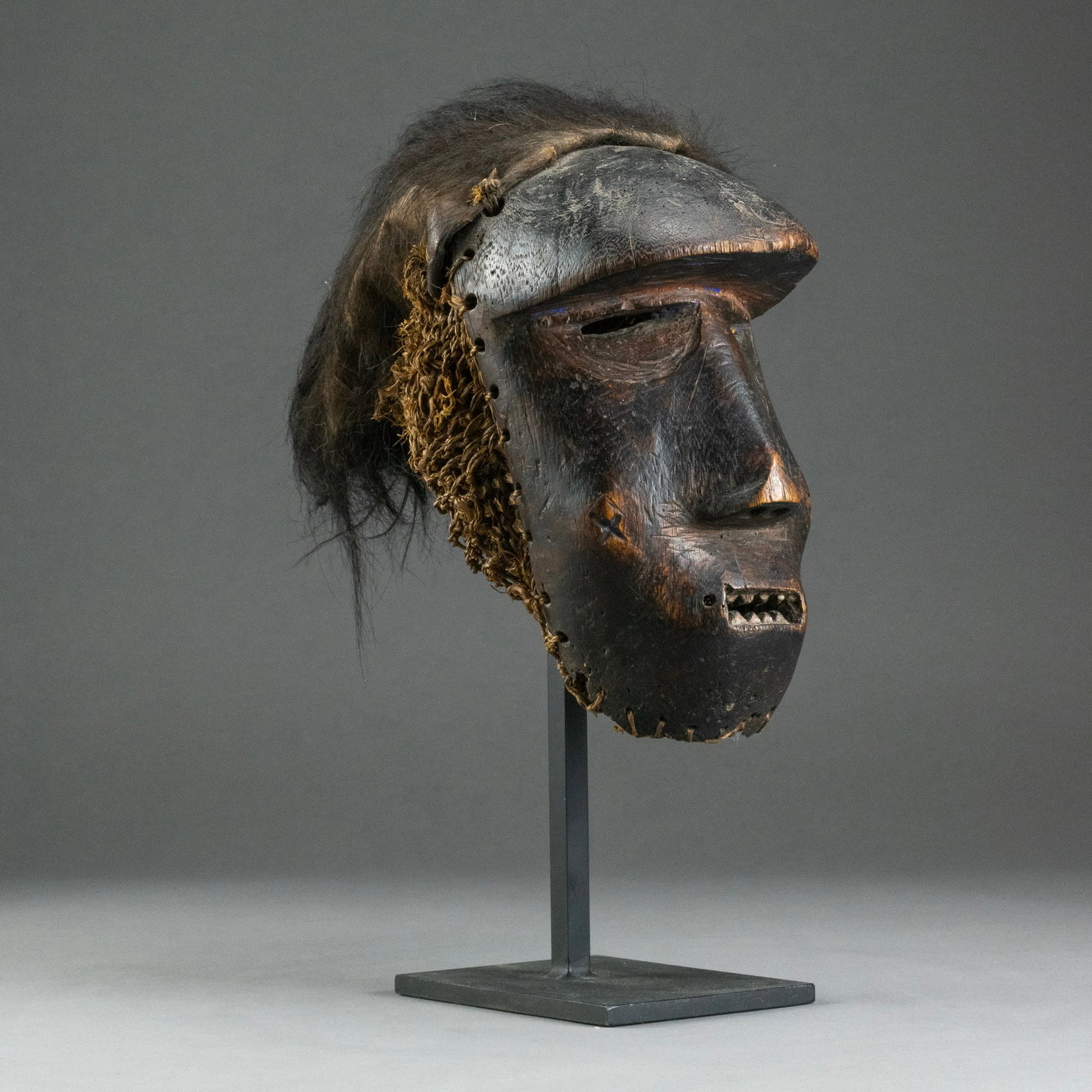 Katoyo (Foreignor) Mask, Chokwe People, Angola/D. R. Congo: Brutish Katoyo mask from the Chockwe people of Angola and D.R. Congo in central Africa. Because the purpose of these masks was to ridicule colonials and foreigners, the features are often distorted; t