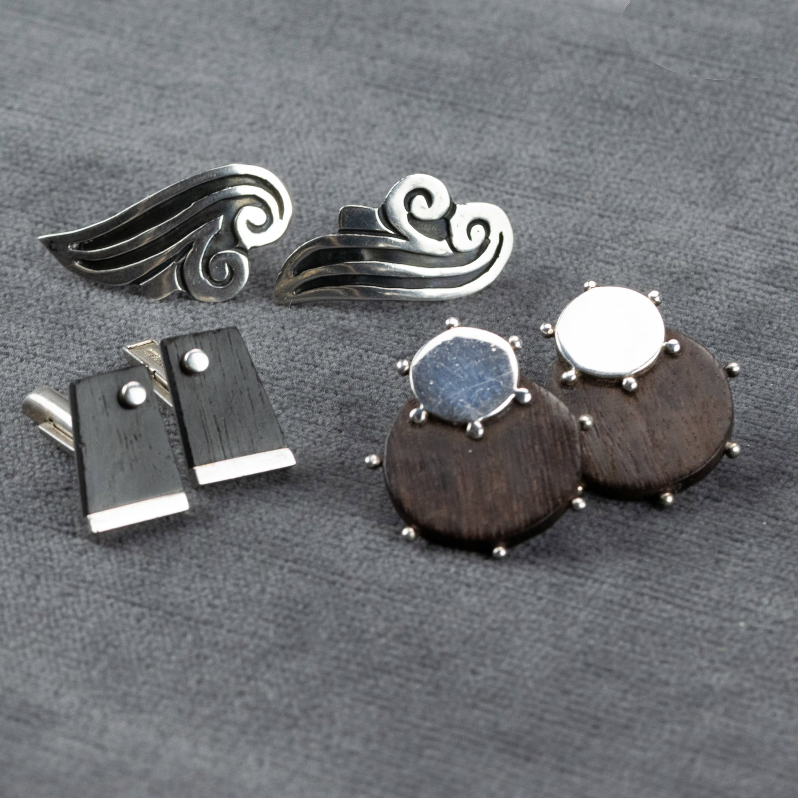 Two Pairs of Silver Earrings and Pair of Silver Cufflinks: Sucesores de William Spratling, Gutierez: Sucesores de William Spratling Sterling and Wood Earrings (Pierced), Taxco, Mexico Overlapping sterling silver and teak(?) discs with applied silver beads along outer edge. Circa 1980s. Marked with Su
