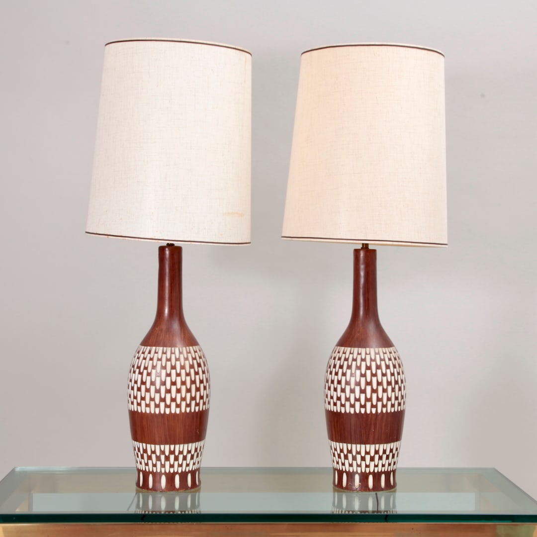 Mid Century 1959, Fortune Ceramic Lamps - a Pair: Painted ceramic lamps with original shades, marked on lower base - C1959 Fortune. Lamp base 22" tall, 33.5" tall to top of finial, 7" in diameter, Shade 14.25" in diameter.