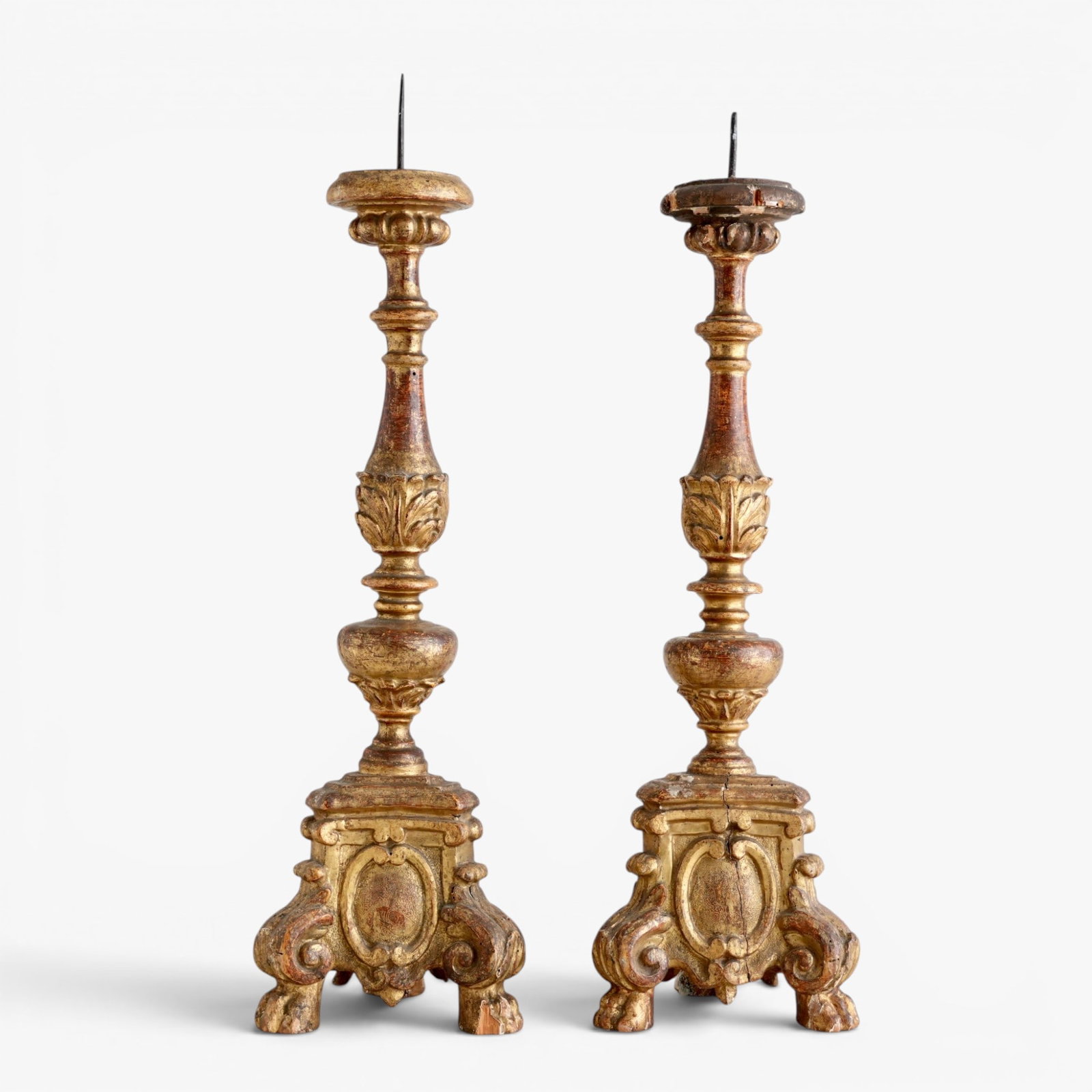 Pair of Italian Baroque Style Giltwood Candle Prickets: 18th/19th century, multi-tiered with elaborate scrollwork and acanthus leaf motifs The collection of Frank and Irene Giuffrida, owners of the famous Hilltop Steakhouse, Saugus, MA