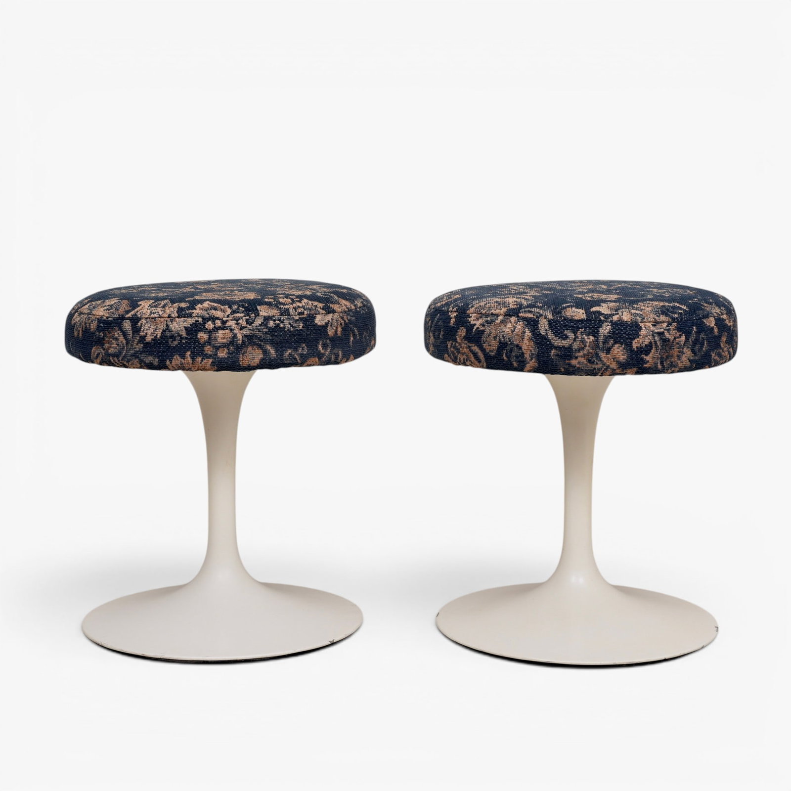 Pair of Vintage Mid Century Modern Knoll Tulip Swivel Stools by Eero Saarinen: Mid 20th century, Floral fabric upholstery and white cast aluminum bases, marked on underside with original Knoll labels The collection of Frank and Irene Giuffrida, owners of the famous Hilltop