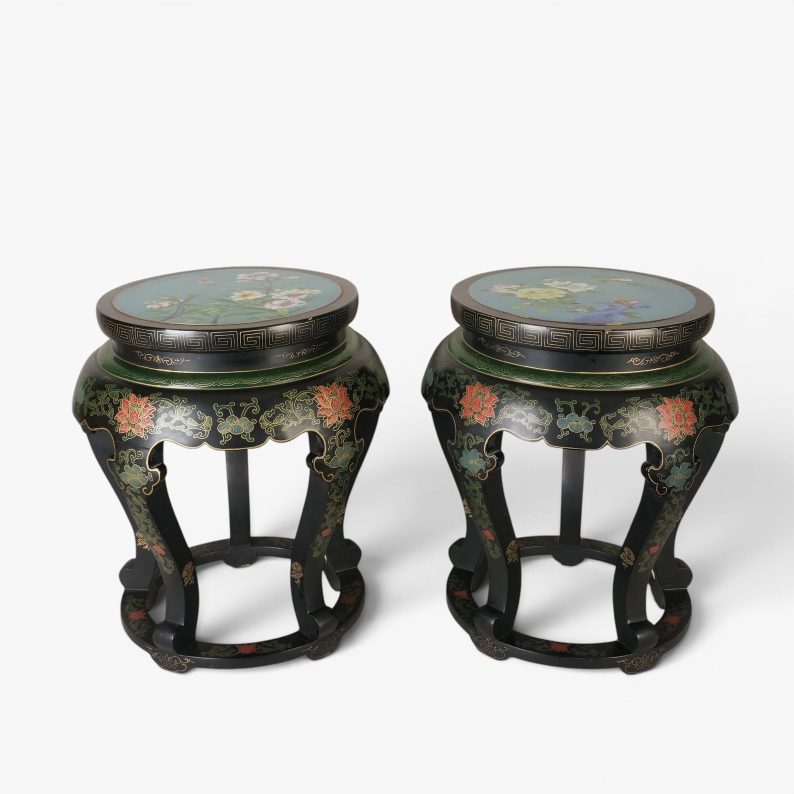 Pair of Chinese Cloisonne and lacquered Wood Stools: 20th century, the cloisonne seat with a scene of blossoming peony, flowers and birds on a medium blue ground inset into wood frames lacquered with blossoming lotus on scrolling, leafy vines all on a b