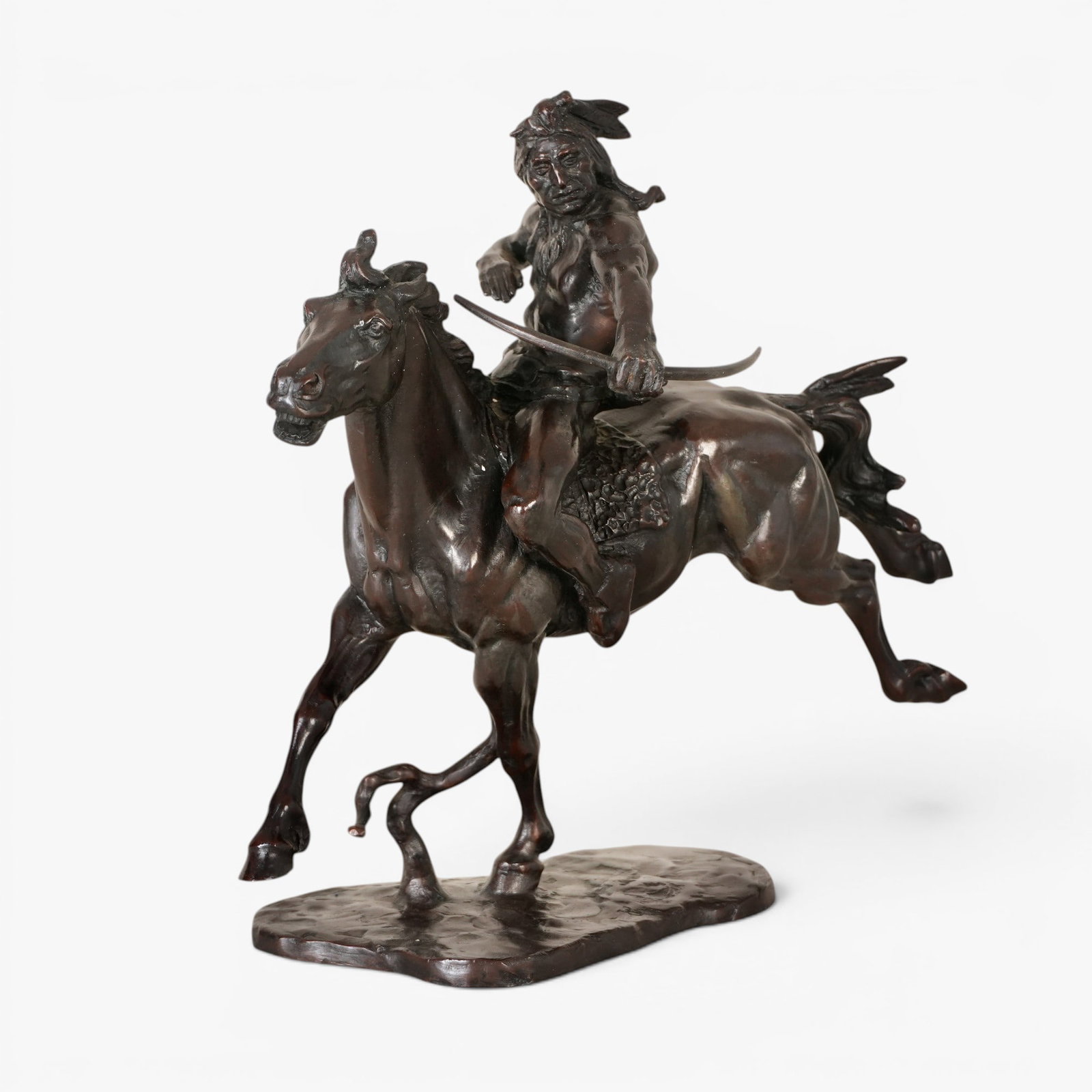 Bronze sculpture "The Indian Hunter": John Weaver, Circa 1975, The Franklin Mint, marked with symbol on base and label on underside, depicting an American Indian riding a galloping horse The collection of Frank and Irene Giuffrida, owners