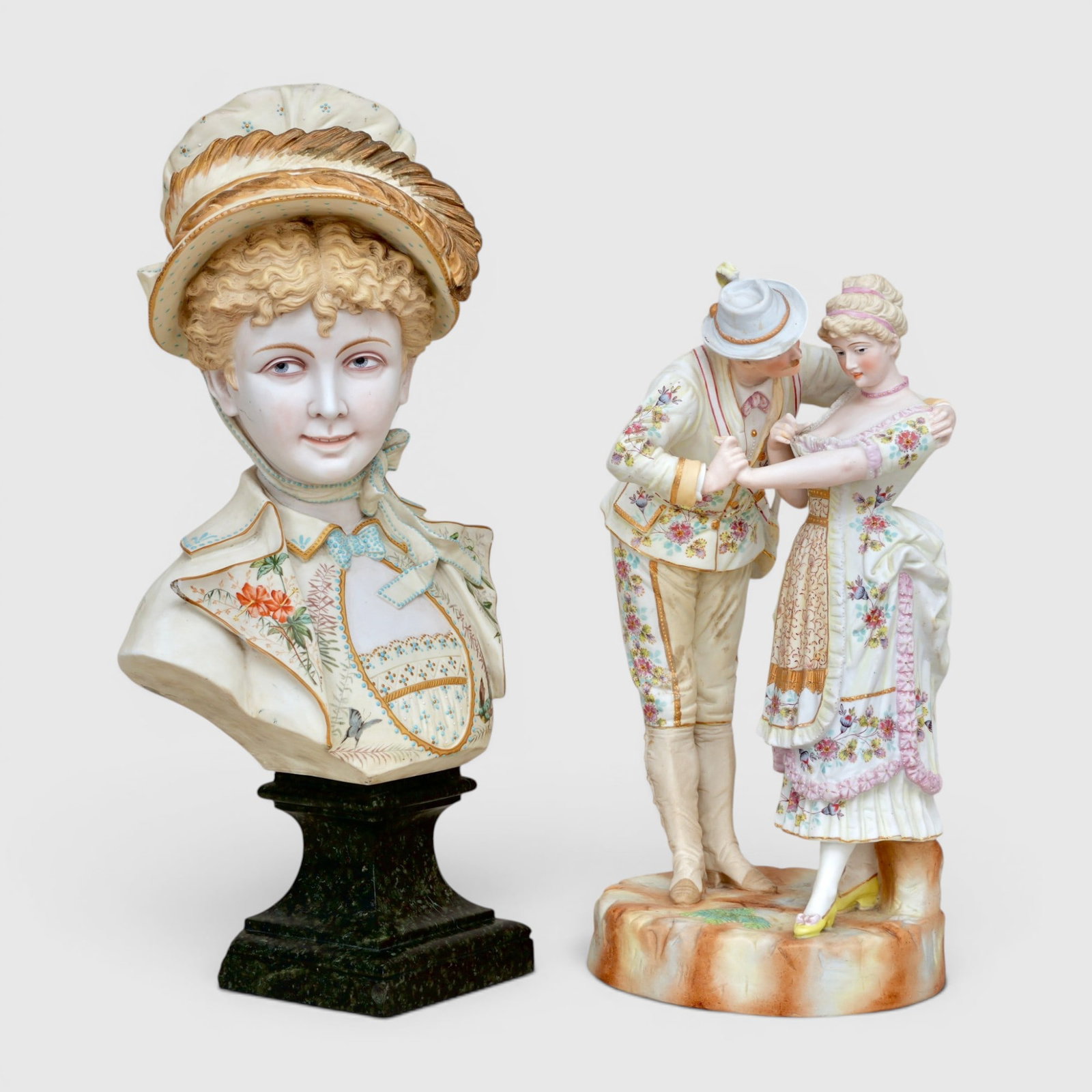 Bisque Porcelain Bust of a Girl and Bisque Porcelain Courting Couple: The girl in a bonnet, jacket and dress with bird and flower detailing; the couple in matching outfits, hand painted, unsigned The collection of Frank and Irene Giuffrida, owners of the famous Hilltop