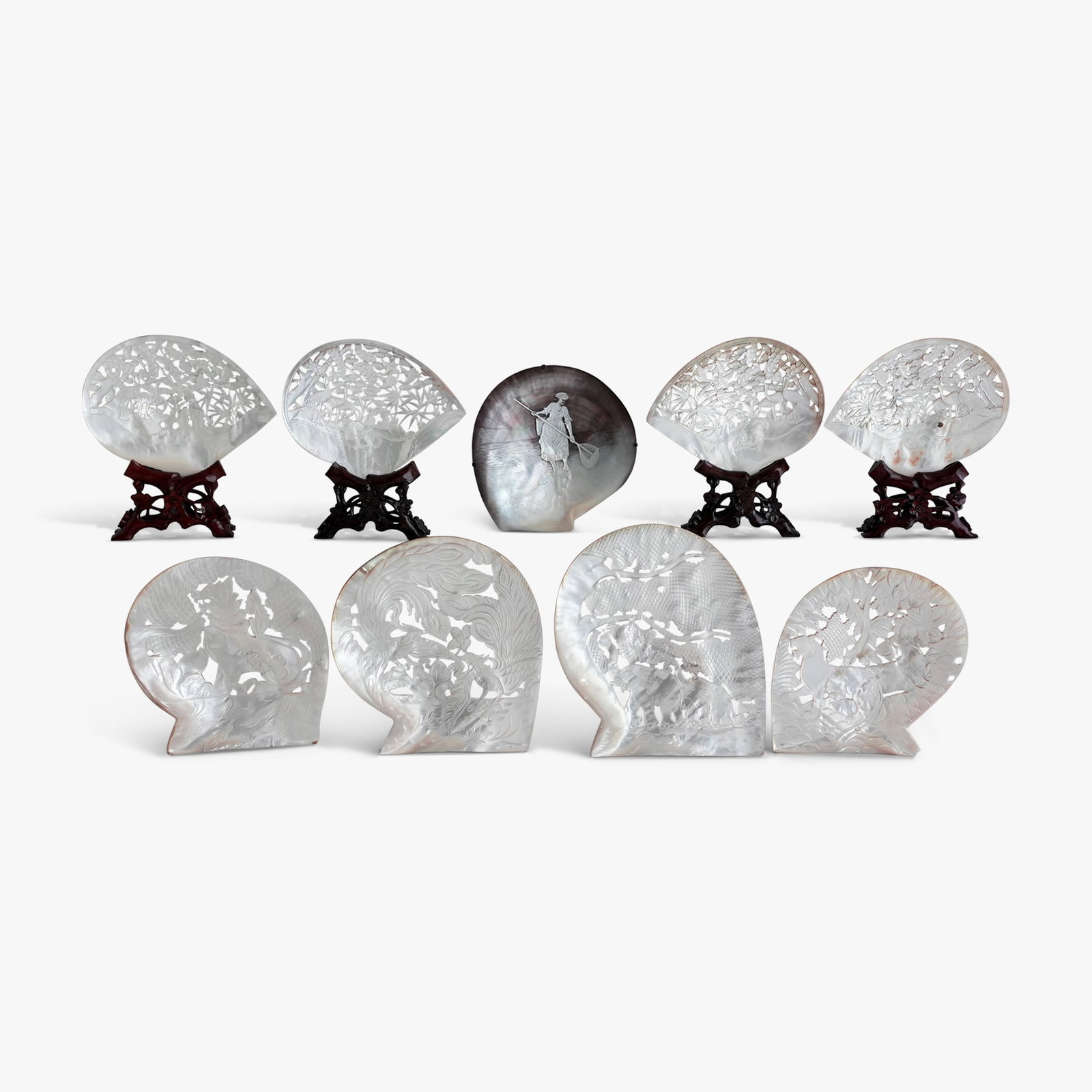 Nine Chinese Mother of Pearl Shell Sculptures: Pierced and carved in relief with foliate and figural designs on the natural shell form The collection of Frank and Irene Giuffrida, owners of the famous Hilltop Steakhouse, Saugus, MA