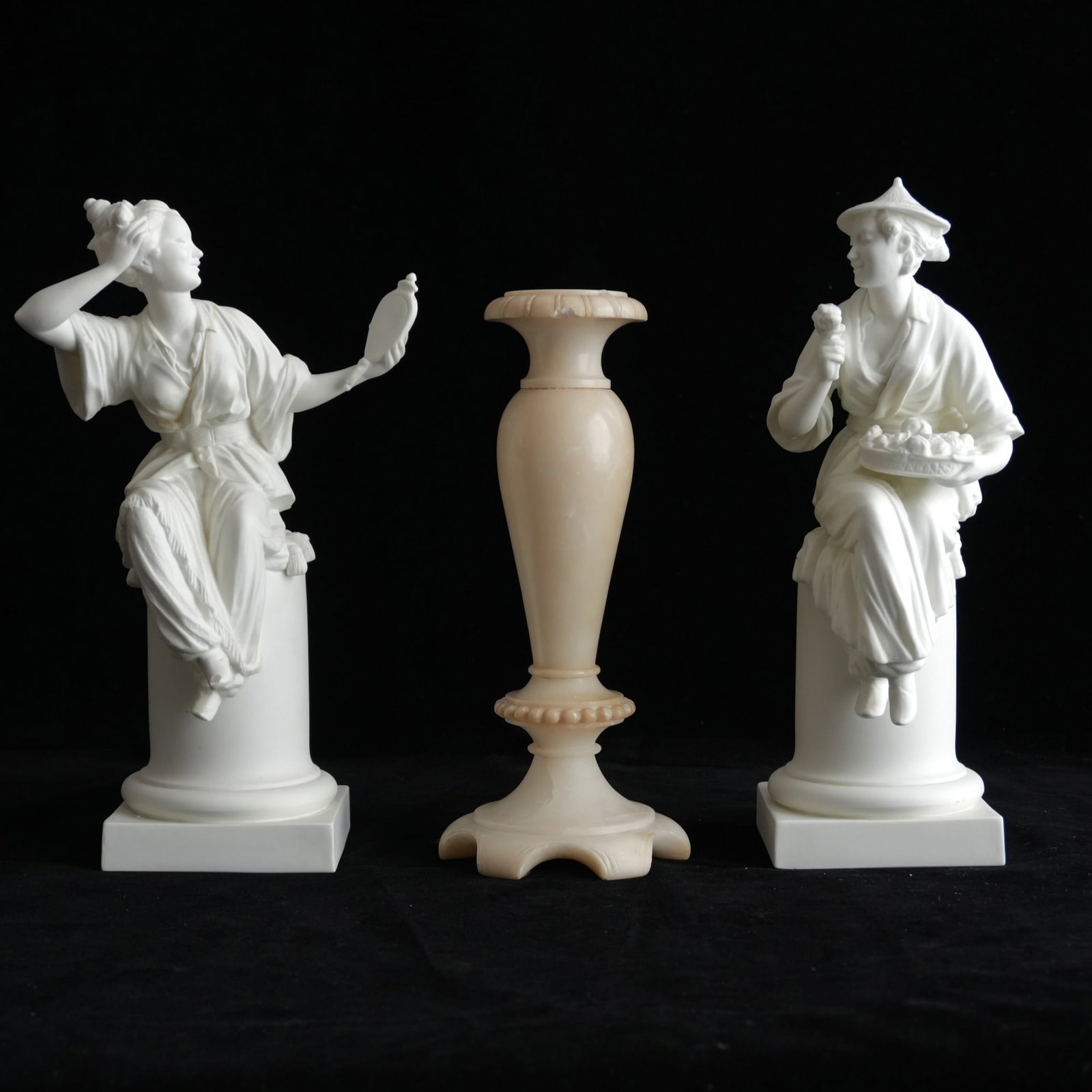 Two Royal Worcester Bisque Figures together with a Marble Candlestick: Titled "Le Mirroir" and "La Fleur", bases with stamp reading Modelled by A. Azori, Royal Worcester, bone china, Made in England, 3586 La Fleur and 3588 Le Miroir; together with a marble candlestick