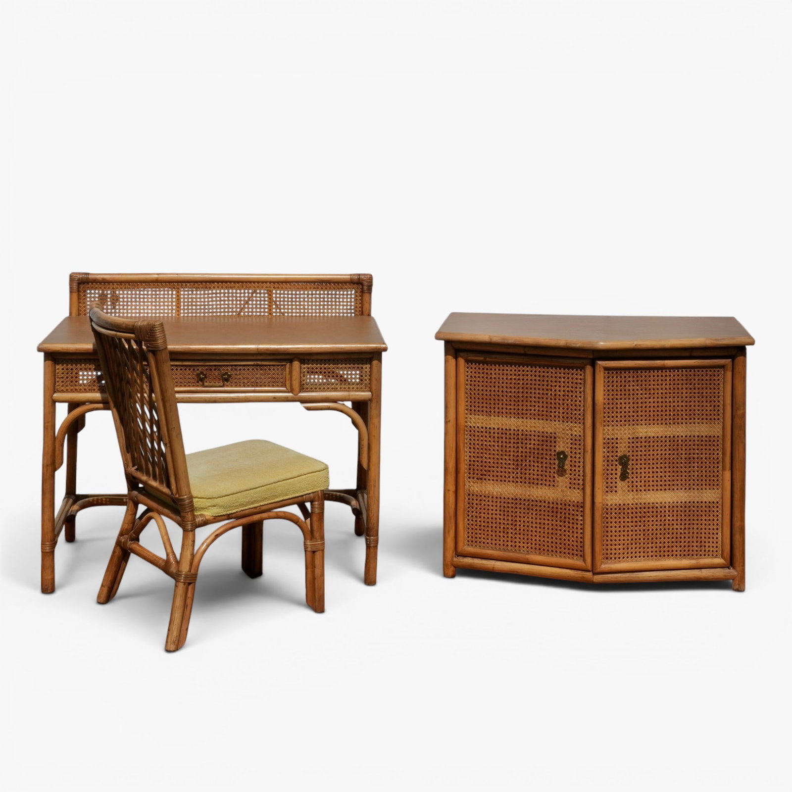Vintage Rattan Writing Desk, Chair and Cabinet: mid century, the desk with a central drawer, yellow upholstery cushion on chair seat; desk overall height 36, height to writing surface 30.5, width 40, depth 20.5 inches; chair height 35, seat height