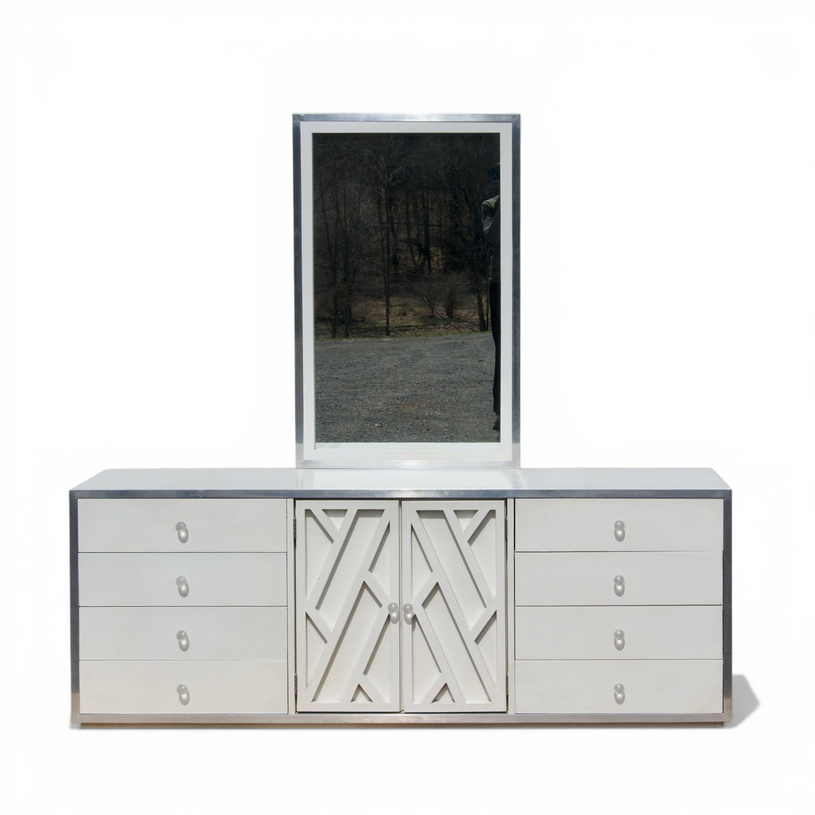 Vintage Milo Baughman Style Dresser Credenza with Mirror: Chrome edged, geometric lattice relief design, circular lucite drawer pulls, dovetail jointed drawers, mirror measures 44" H x 28" W The collection of Frank and Irene Giuffrida, owners of the famous H