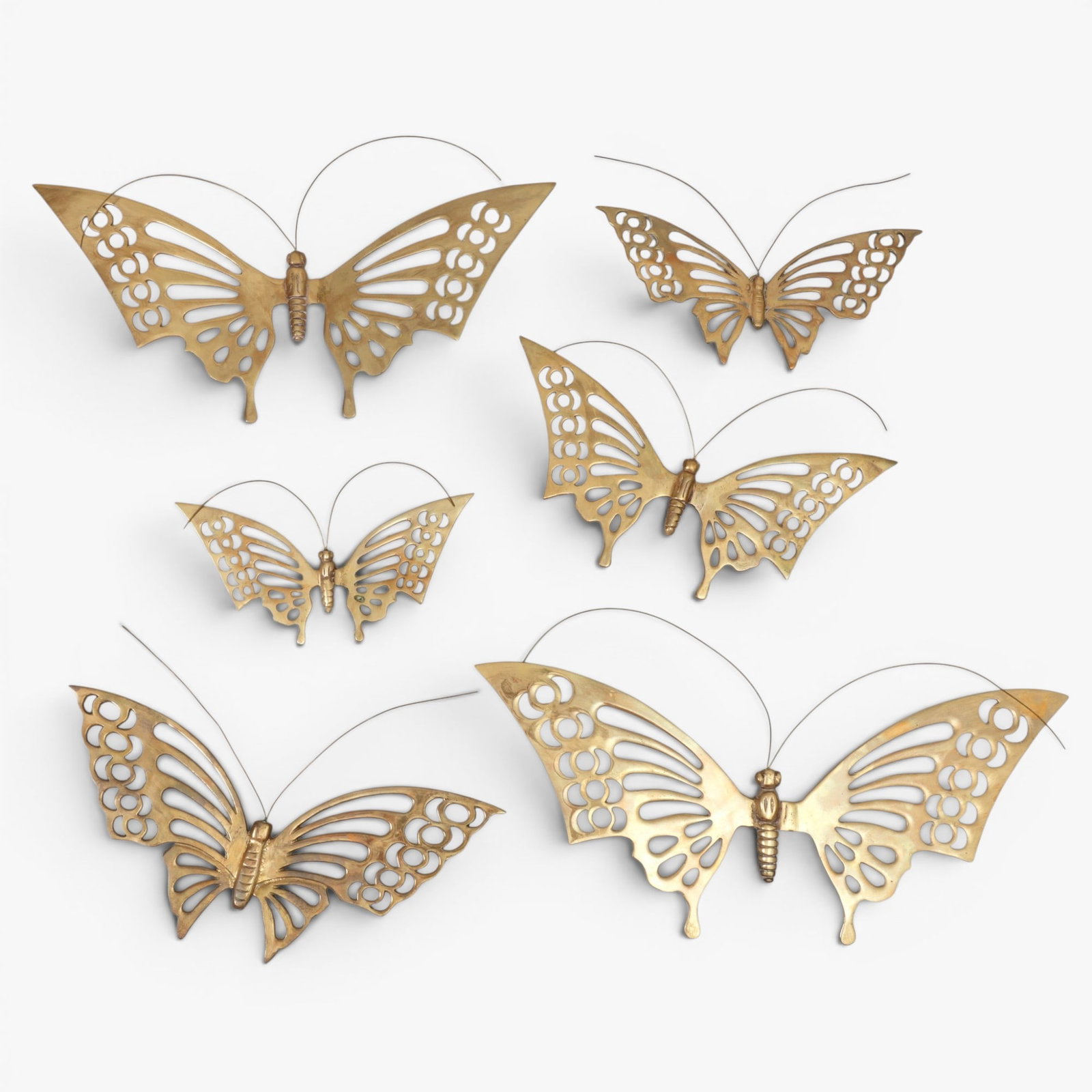 Group of Six Vintage Solid Brass Butterfly Wall Sculptures: Vintage brass butterfly wall sculptures with openwork design on wings The collection of Frank and Irene Giuffrida, owners of the famous Hilltop Steakhouse, Saugus, MA
