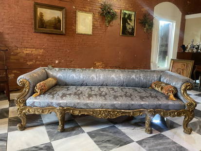 Incredible & large 18th century carved French gilt wood sofa: Very fine Antique 18th century carved and gilt wood sofa. Beautiful upholsteryThis wonderful sofa was used on the Warner Bros. television show The OriginalsOne rear leg is missing some carving. The so