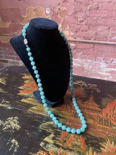 Fine Qing Dynasty jadeite necklace: Very fine Qing Dynasty celadon jadeite necklace with silver clasp. Acquired in China around the 1920’s by the family’s estate. Some beautiful color in this luxurious strand of antique Ch