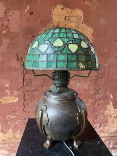 Arts and crafts period Tiffany Studios Acorn Lamp: Signed Tiffany Studios Table lamp with Acorn pattern shade. This beautiful Art Nouveau stained glass lamp is by or in the manner of Tiffany Studios. We are just not sure. Shade and base signed. A