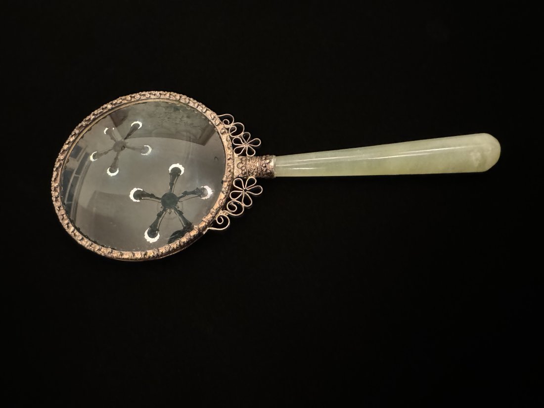 Qing Dynasty Jade and silver magnifying glass: Fine Qing Dynasty and Jade with silver metal work magnifying glass. Quite powerful. Nice ware from use