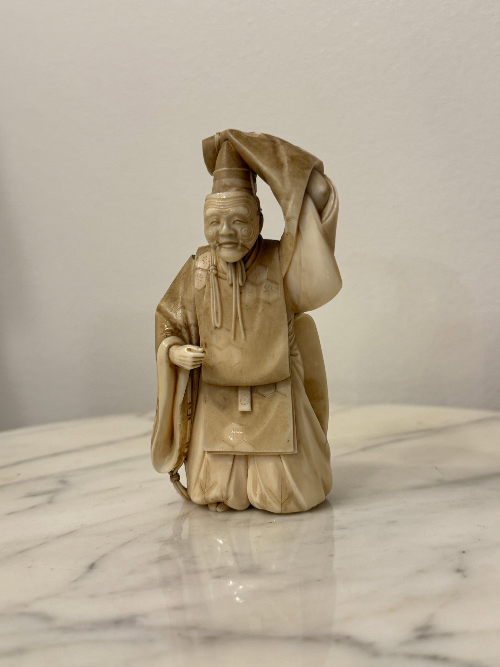 Fine antique Meiji period Japanese carved figure SIGNED: Very fine antique 19th century Japanese carved figure. Superbly carved. Fine detail throughout. Signed on the bottom on a red plaque. From a prominent old collection.