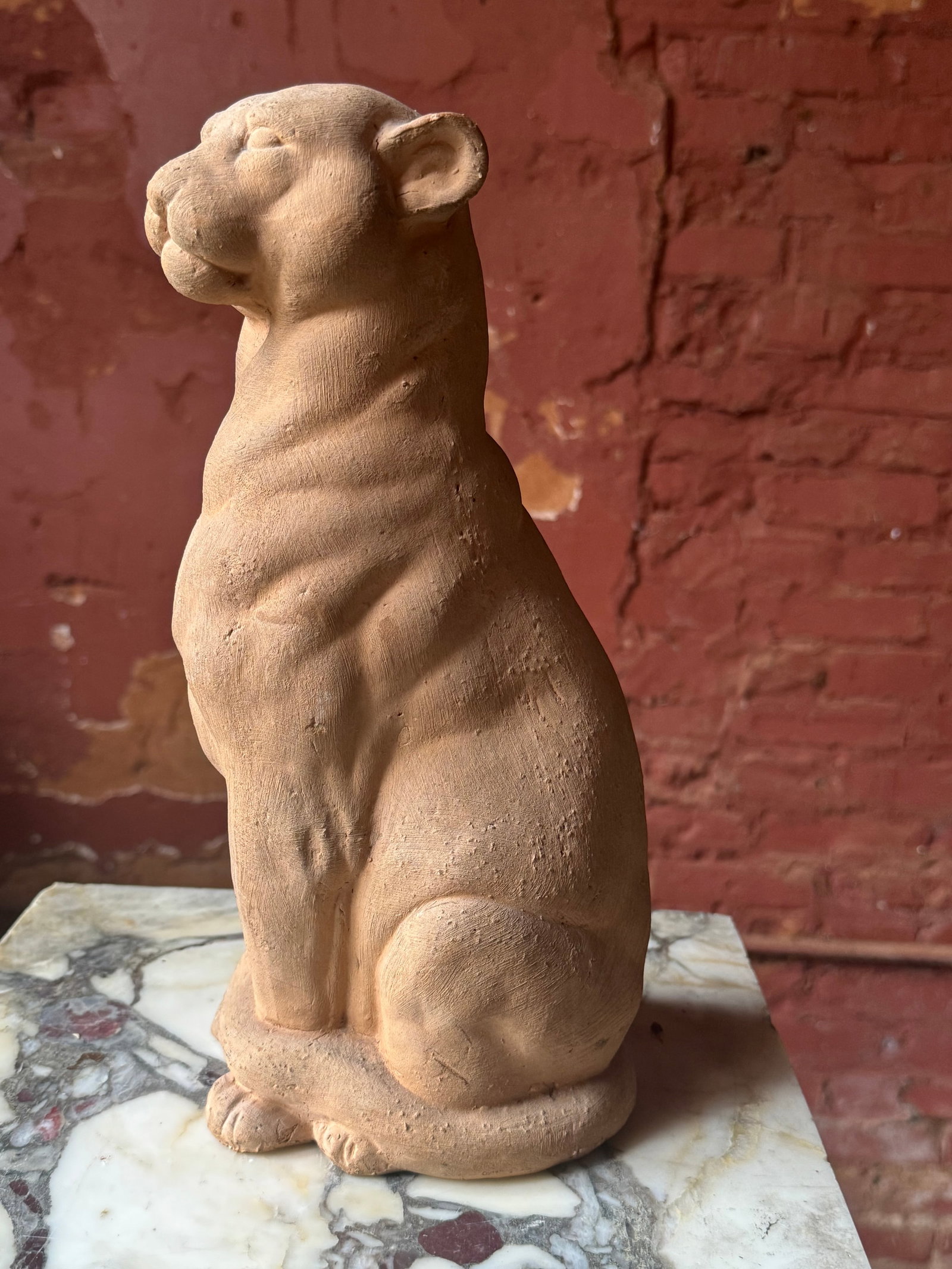 Antique French terra-cotta lion sculpture: Antique terra-cotta sculpture of a lion or panther likely French early 20th century in the manner of Barye