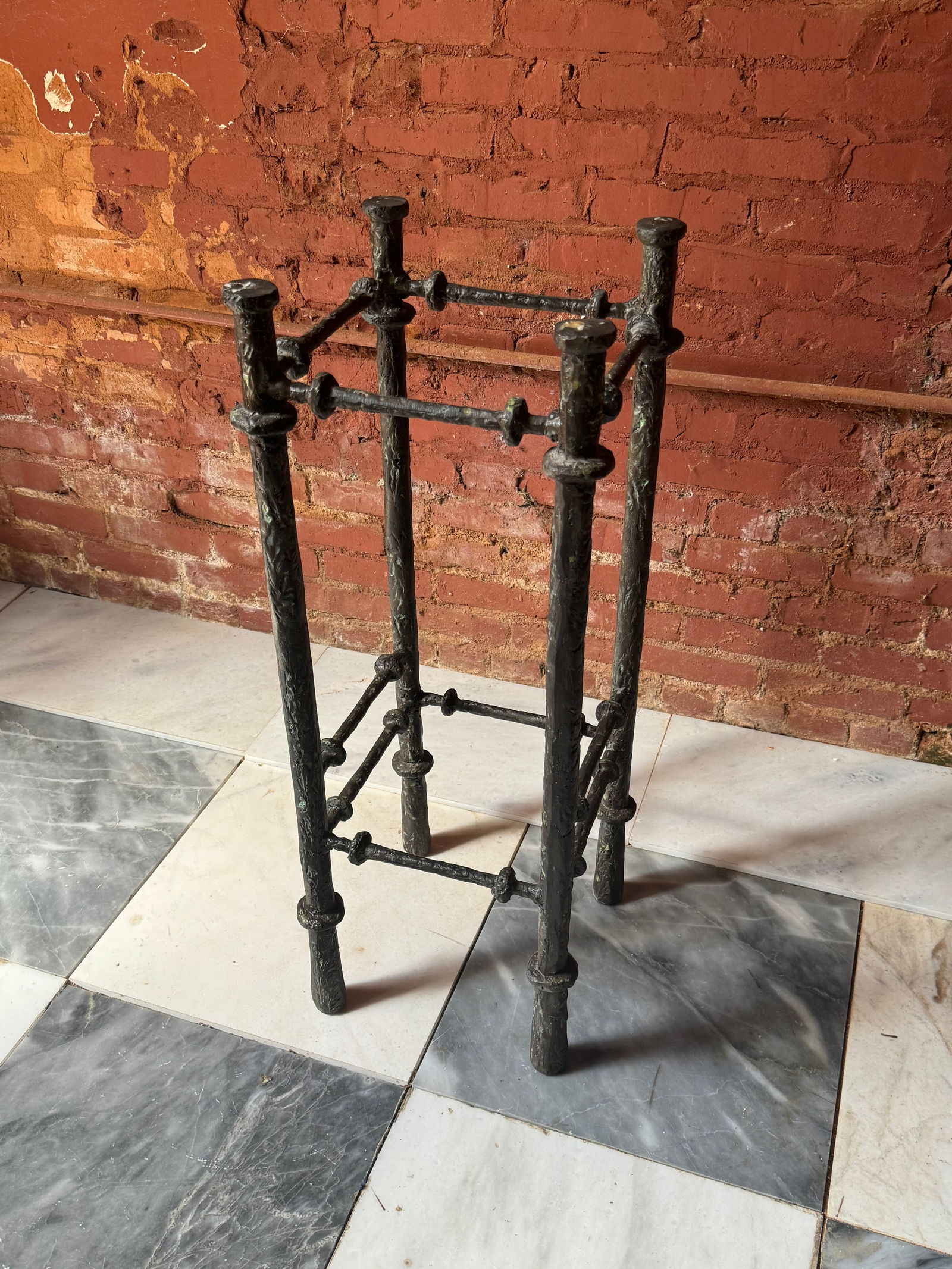 Mid Century Modern Alberto Giacometti style pedestal stand: Amazing vintage mcm Alberto Giacometti style pedestal. Heavy with a beveled glass top. From a Palm Beach estate