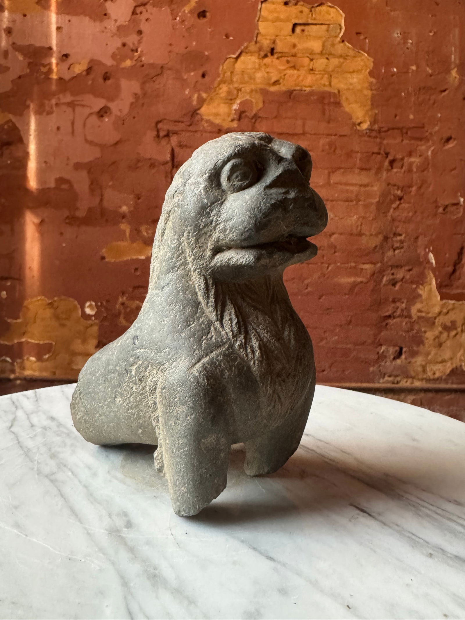 GANDHARA Indian Figure of a Lion 2ND/3RD CENTURY antiquity: A gray schist stone figure of a mighty lionGANDHARA, 2ND/3RD CENTURYFrom a prominent New York City collection