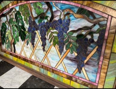 American school stained glass window.: American school stained glass window featuring a beautiful Wisteria trellis motif. Well modeled glass throughout. A beautiful example