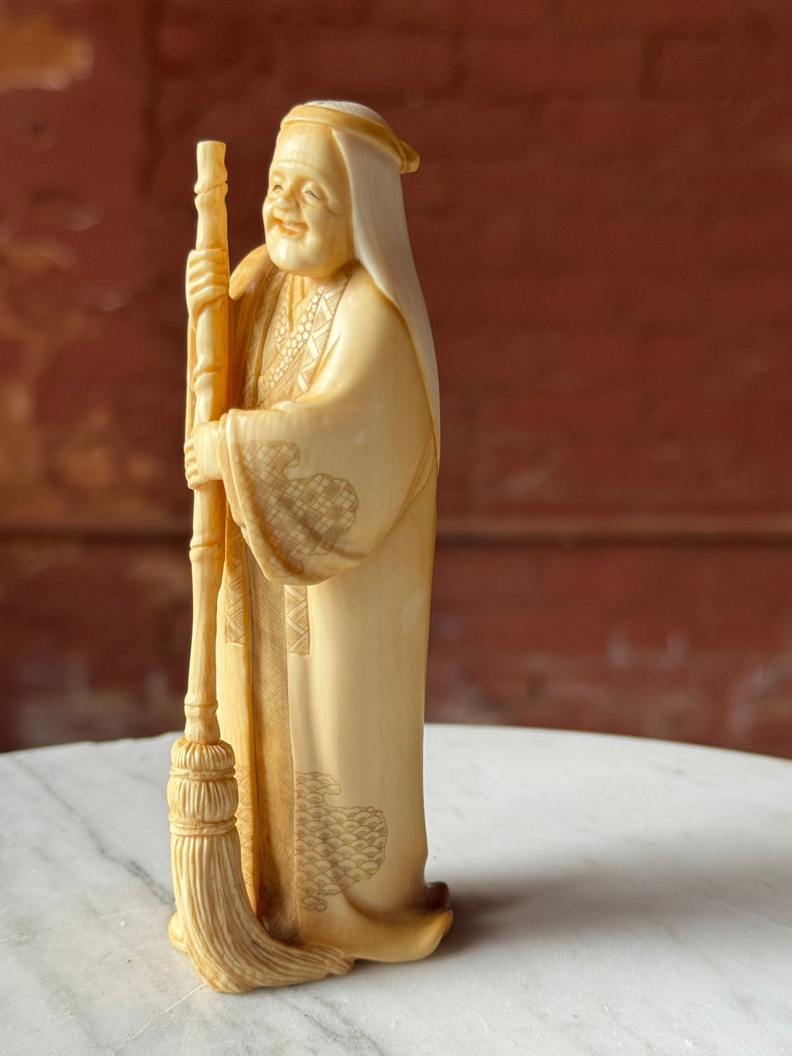 Fine Okimono carved Figure Meiji Period 19th century: Well carved Okimono carved figure dating to the late 19th century Meiji period. From a prominent US Navy collection formed in the 1920s to 1930s.