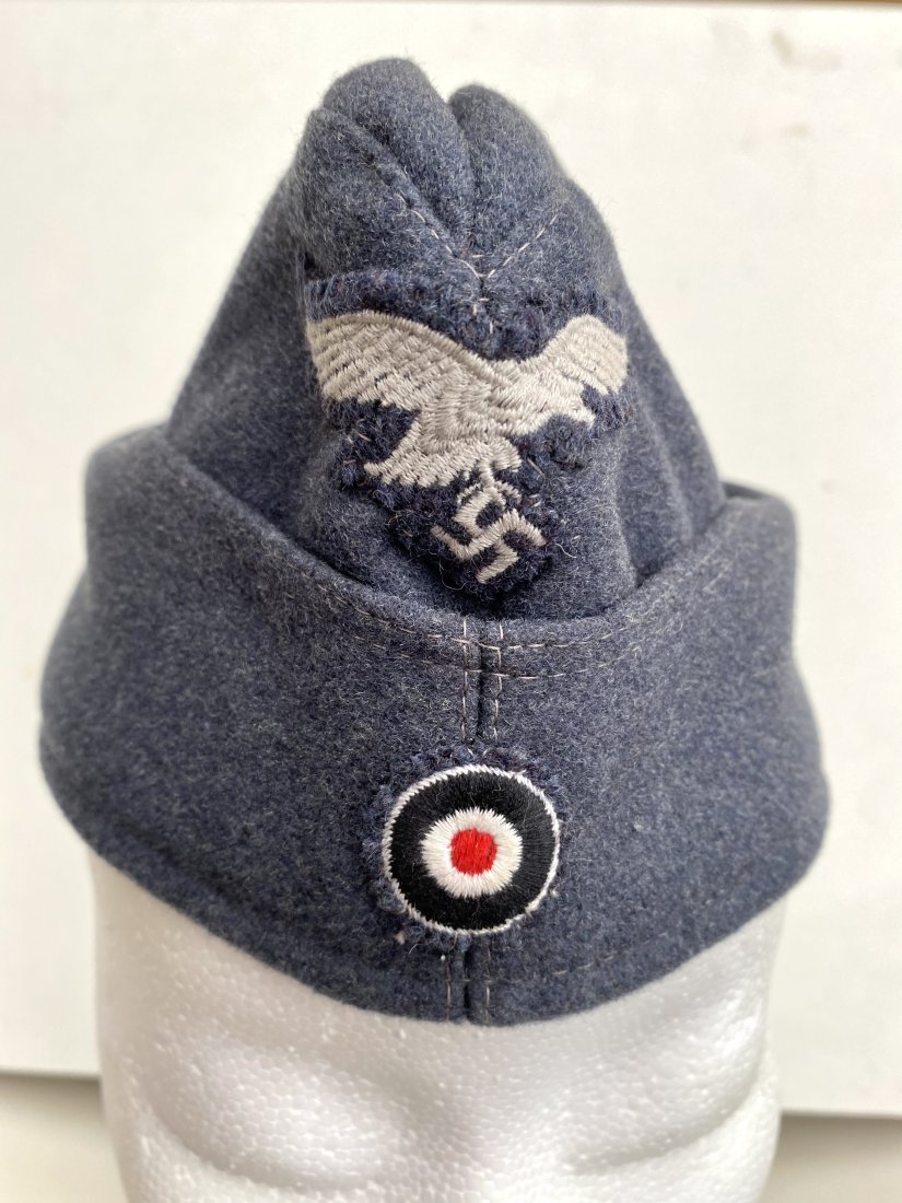 GERMAN LUFTWAFFE (56 F 42) OVERSEAS CAP NAZI WW2: Luftwaffe Overseas Cap. this blue-gray wool cap has a quality silver bullion Luftwaffe eagle on a wool backer sewn upon the peak of the cap at the front. Karl Kubach mutzen-frabrik Mainz-Kastel.