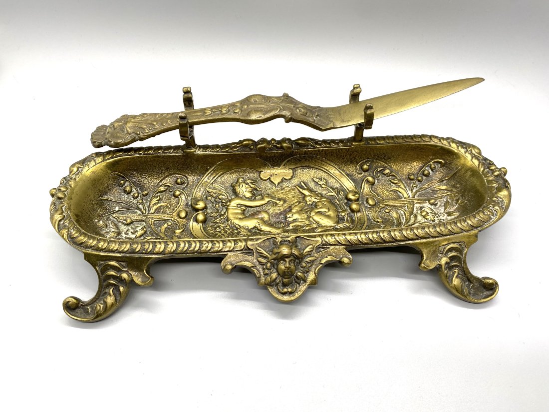 French Art Nouveau Pencil Tray - Letter Opener: This is a vintage French tray with a letter opener.The piece is solid brass with carved details. The base is squared off and while this letter opener is not extremely sharp, it works well for it's int