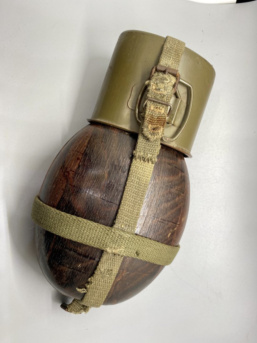 GERMAN FIELD FLASK WWII: W2 German "coconut" canteen with webbing straps. Untouched as found condition. Complete with it's steel khaki painted cup. Very nice used canteen. Will fit DAK uniform too