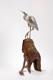 A SILVERED BRONZE OKIMONO, Japan, Meiji period (1868-1912): Depicting an egret with details in shakudo and gilding, resting on a natural wooden base natural wood; signed Masatsune chū within a rectangular gilded reserve. Dimensions: h cm 69