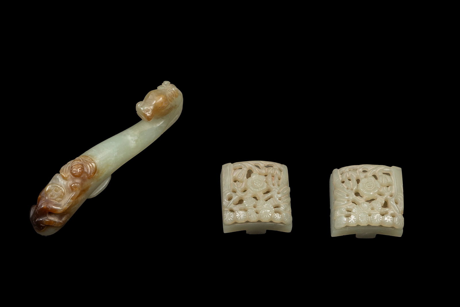 THREE RUSSET-JADE BELT BUCKLES 
China, 19th / 20th century (1 of 2)