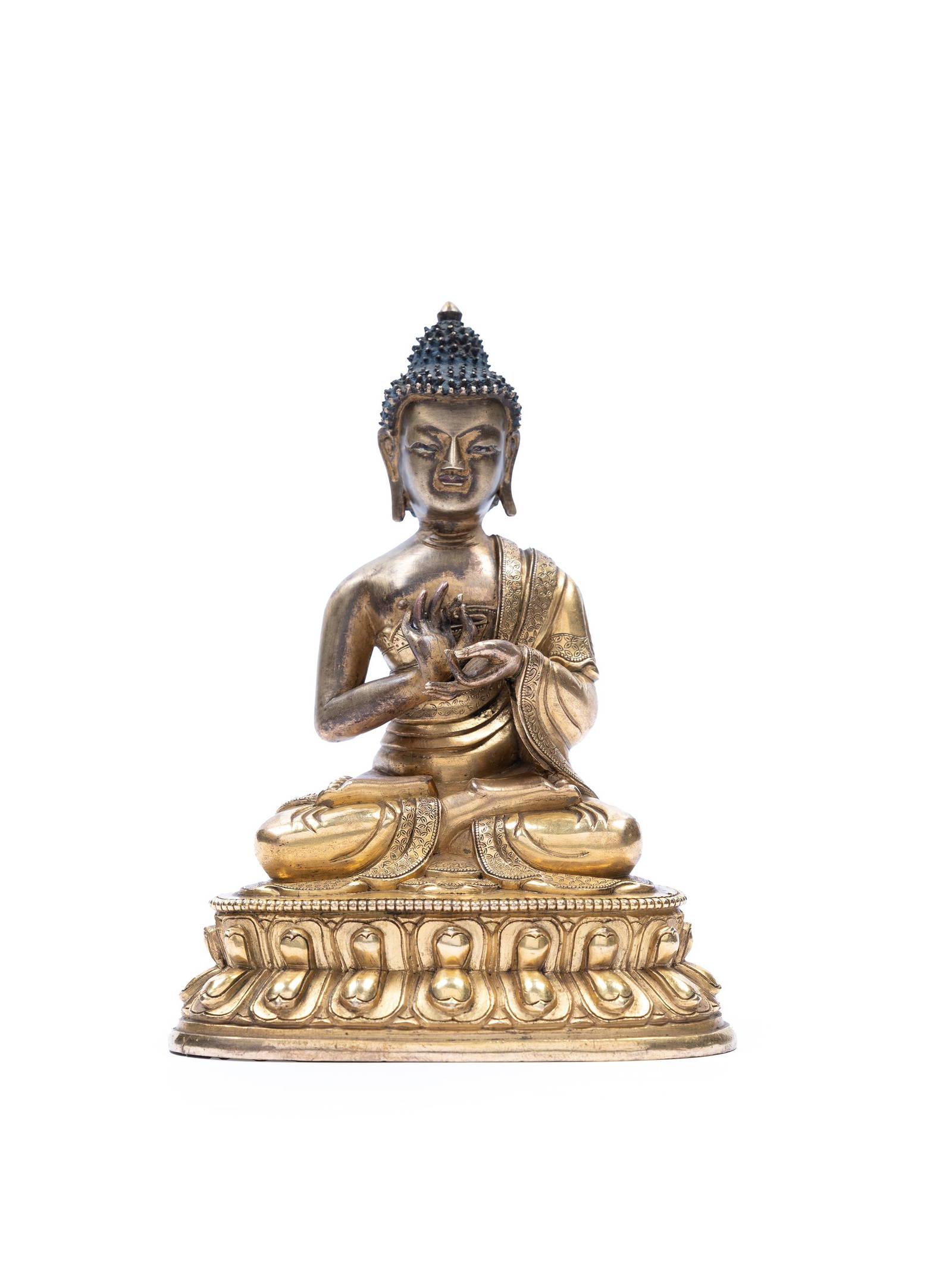 A GILT BRONZE FIGURE OF BUDDHA SHAKYAMUNI, Tibet, 18th century