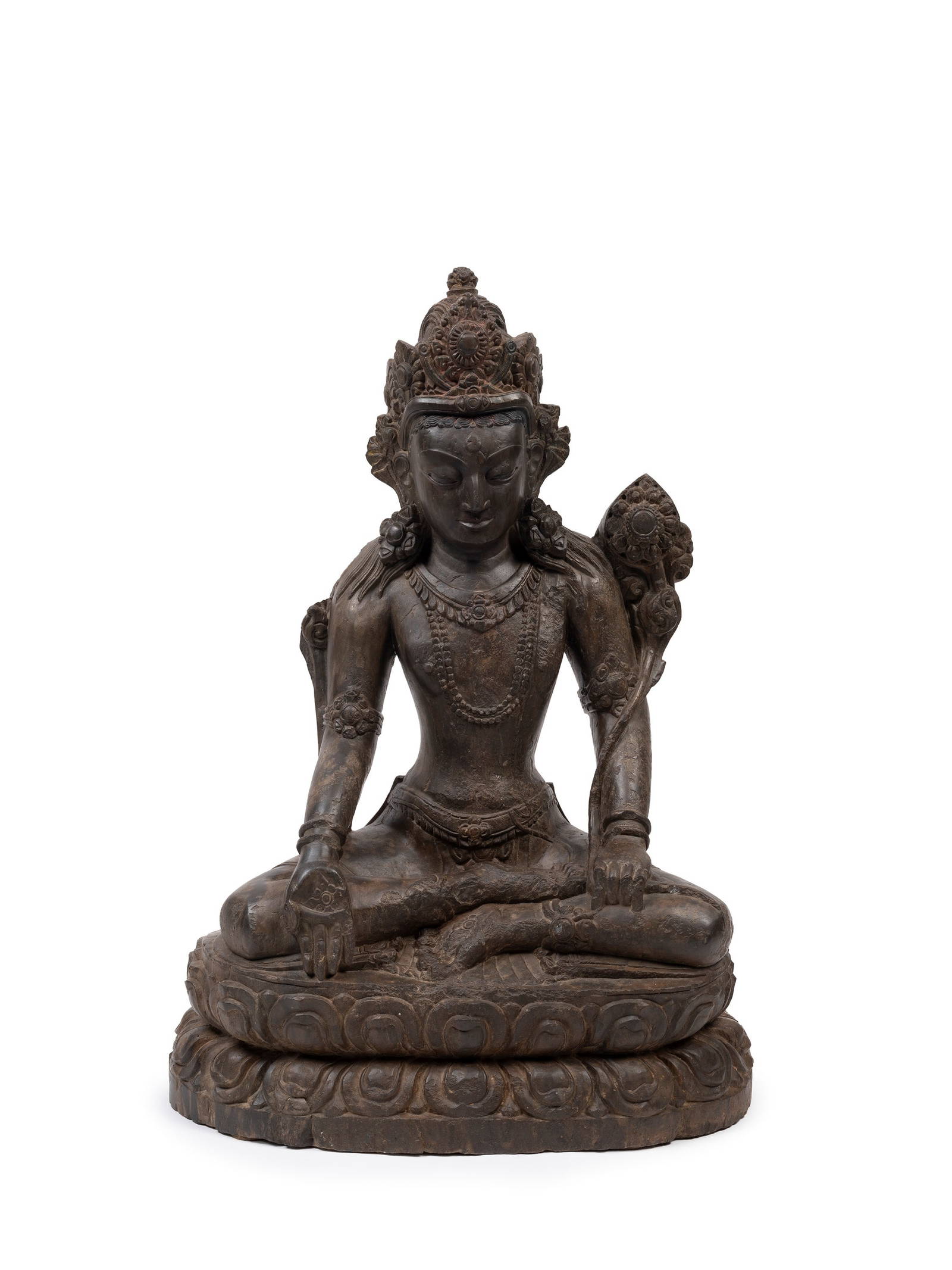 A LARGE STONE FIGURE OF GREEN TARA, Nepal, 17th / 18th century