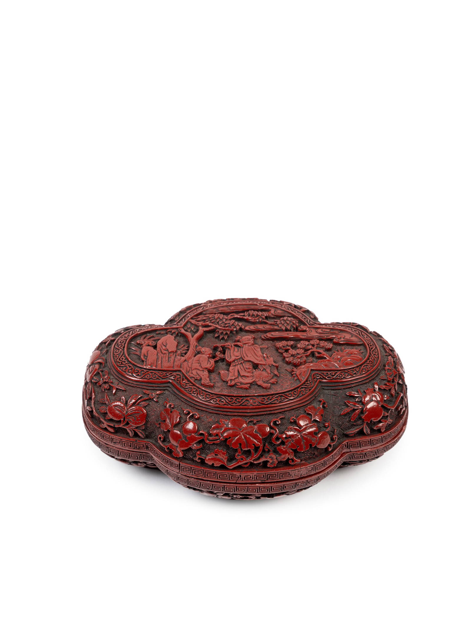 A CINNABAR-LACQUER 'QUATREFOIL' BOX, China, Qing dynasty (1644-1911)