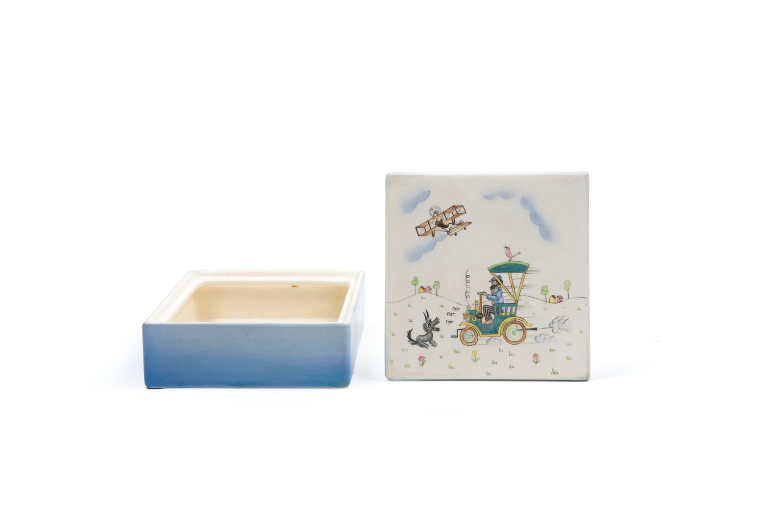 Lenci SQUARE CERAMIC BOX, 20th century: h cm 6 x l cm 16Decorated on the lid with a landscape scene featuring a car and airplane. Signed under the base Lenci Made in Italy.