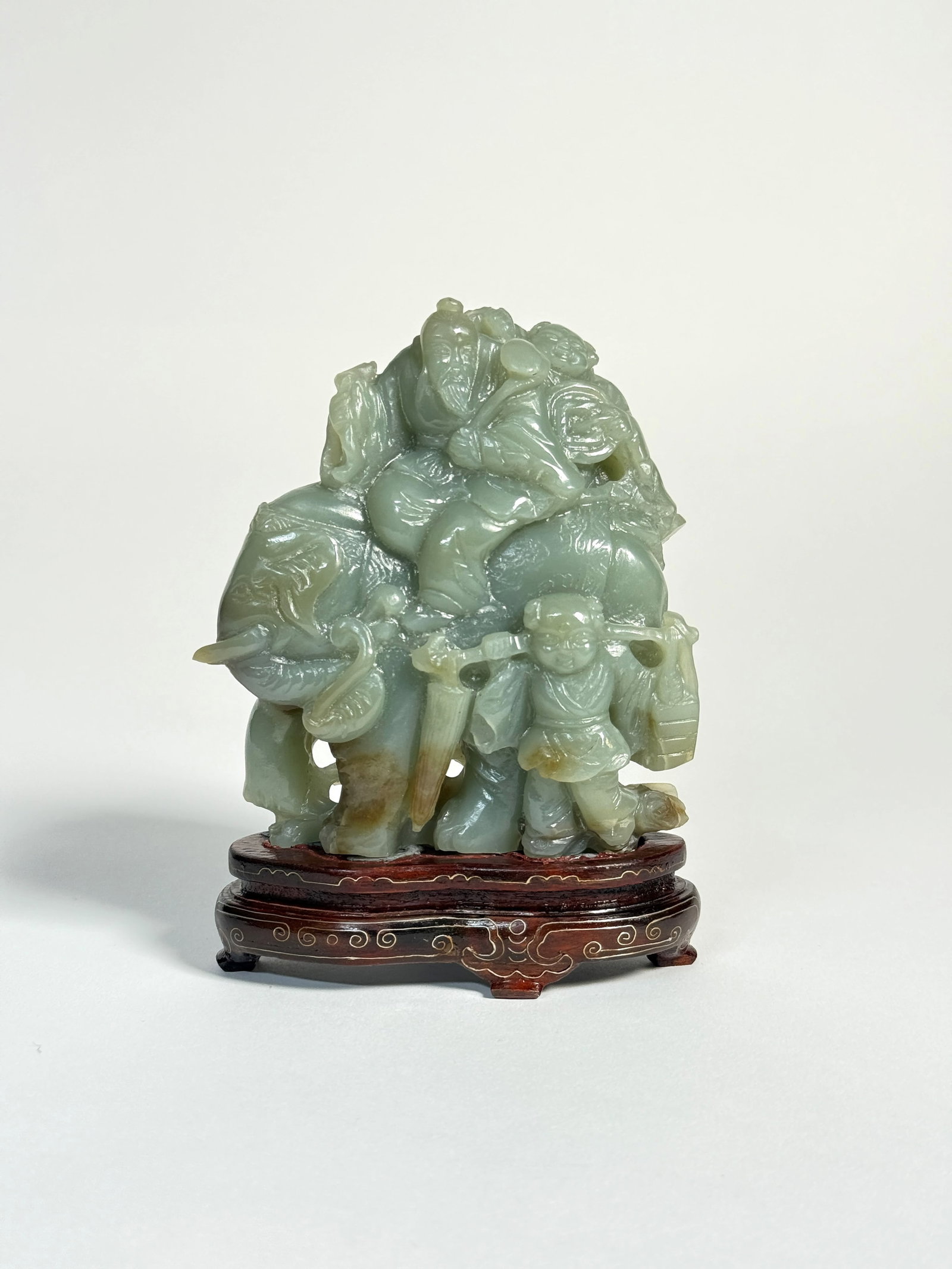 A SERPENTINE JADE SCULPTURE, China, 20th century (1 of 2)