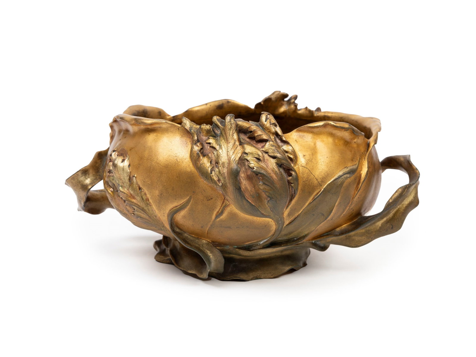 AN ART NOUVEAU GILT BRONZE CENTERPIECE, Early 20th century: h cm 14,5 x l cm 30 Oval in shape, decorated with tulips forming two side handles, signed F. Debon.