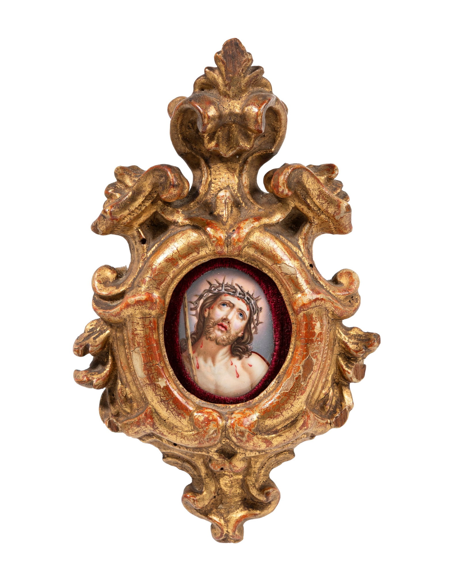 ENAMEL PLAQUE SET IN A GILDED WOODEN FRAME, 18th / 19th centuries: h cm 4,6 x l cm 4 (with frame h cm 15 x l cm 9,5).Depicting Christ wearing a crown of thorns within a finely carved and gilded frame.