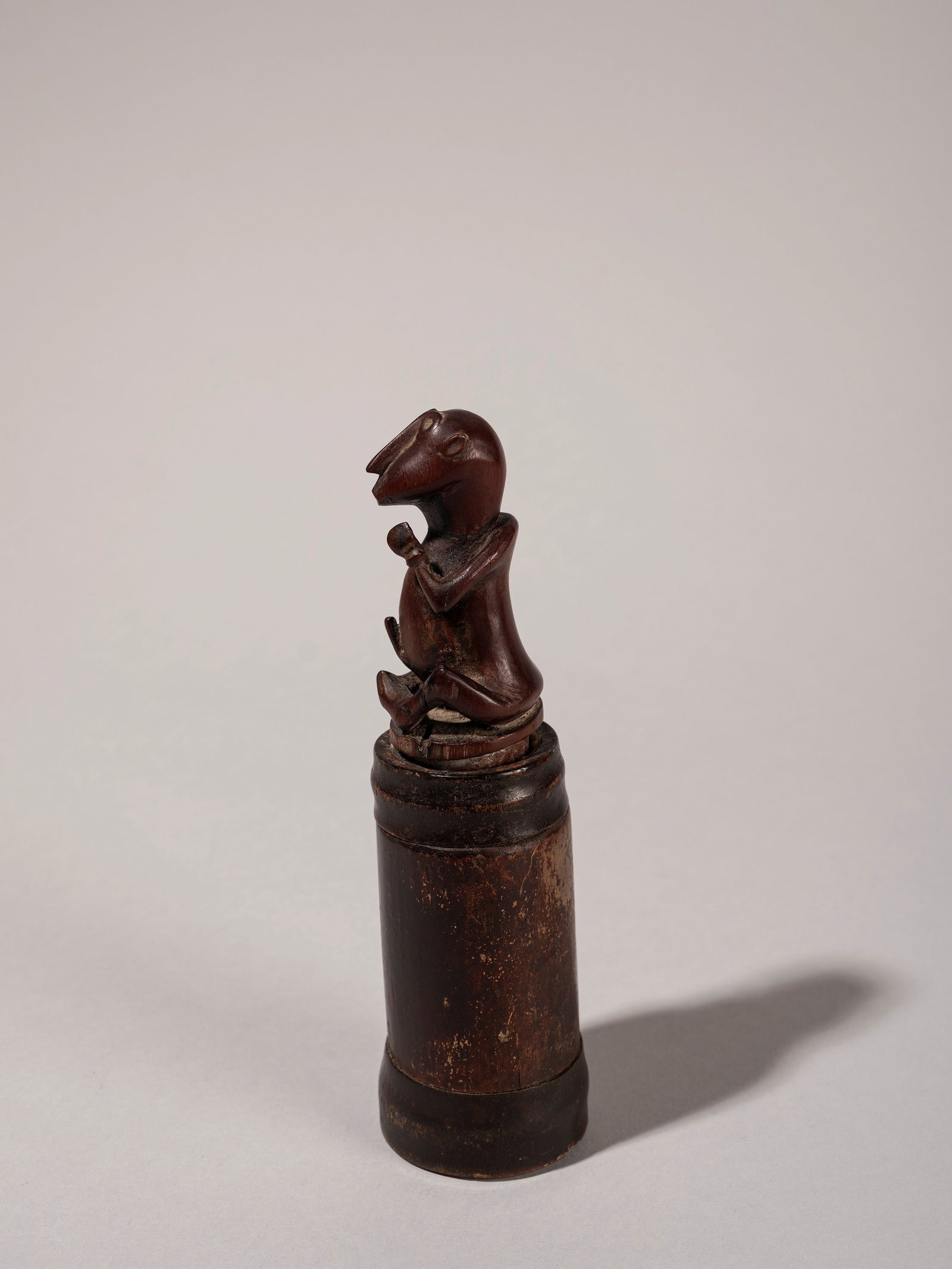A BAMBOO POWDER FLASK WITH ANTHROPOMORPHIC STOPPER, Sumba Island, Eastern Indonesia (1 of 3)