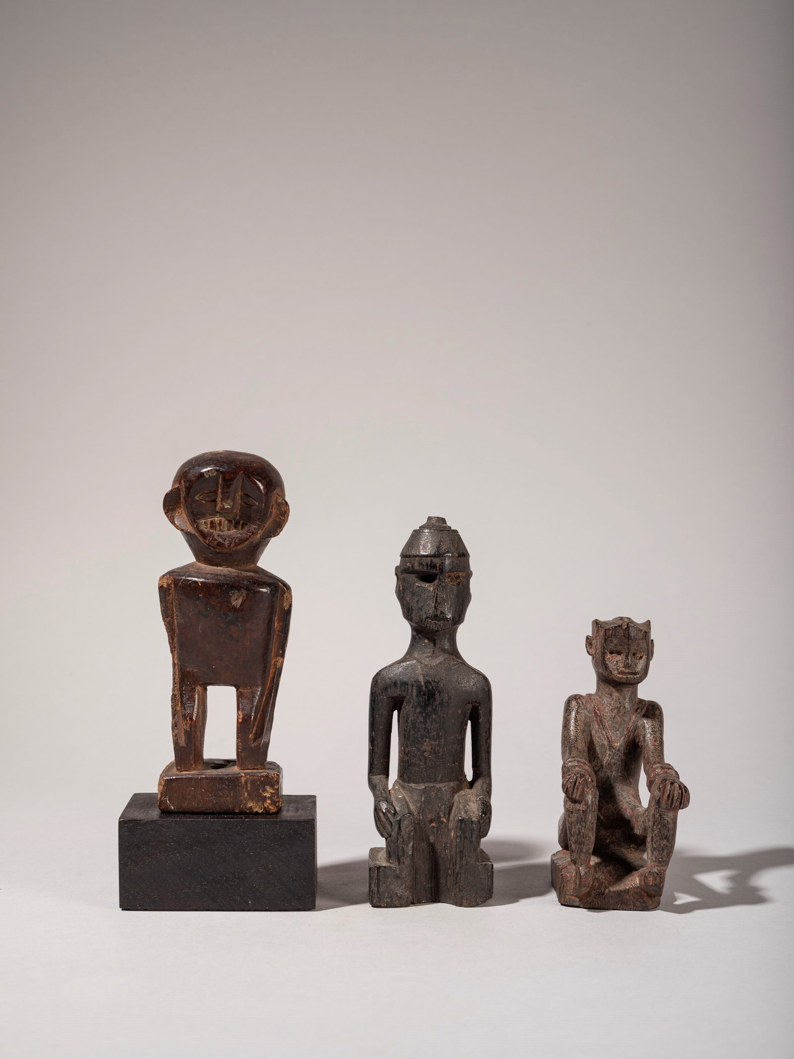 SET OF THREE CHARMS , Dayak ethnic group, West Kalimantan: h max cm 16,5 Wood.