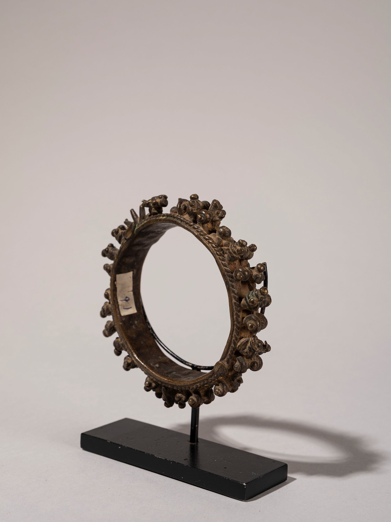 A CEREMONIAL BRONZE BRACELET, North India, first half of the 20th century: d cm 10,5 Provenance: Renzo Freschi Collection, Milan