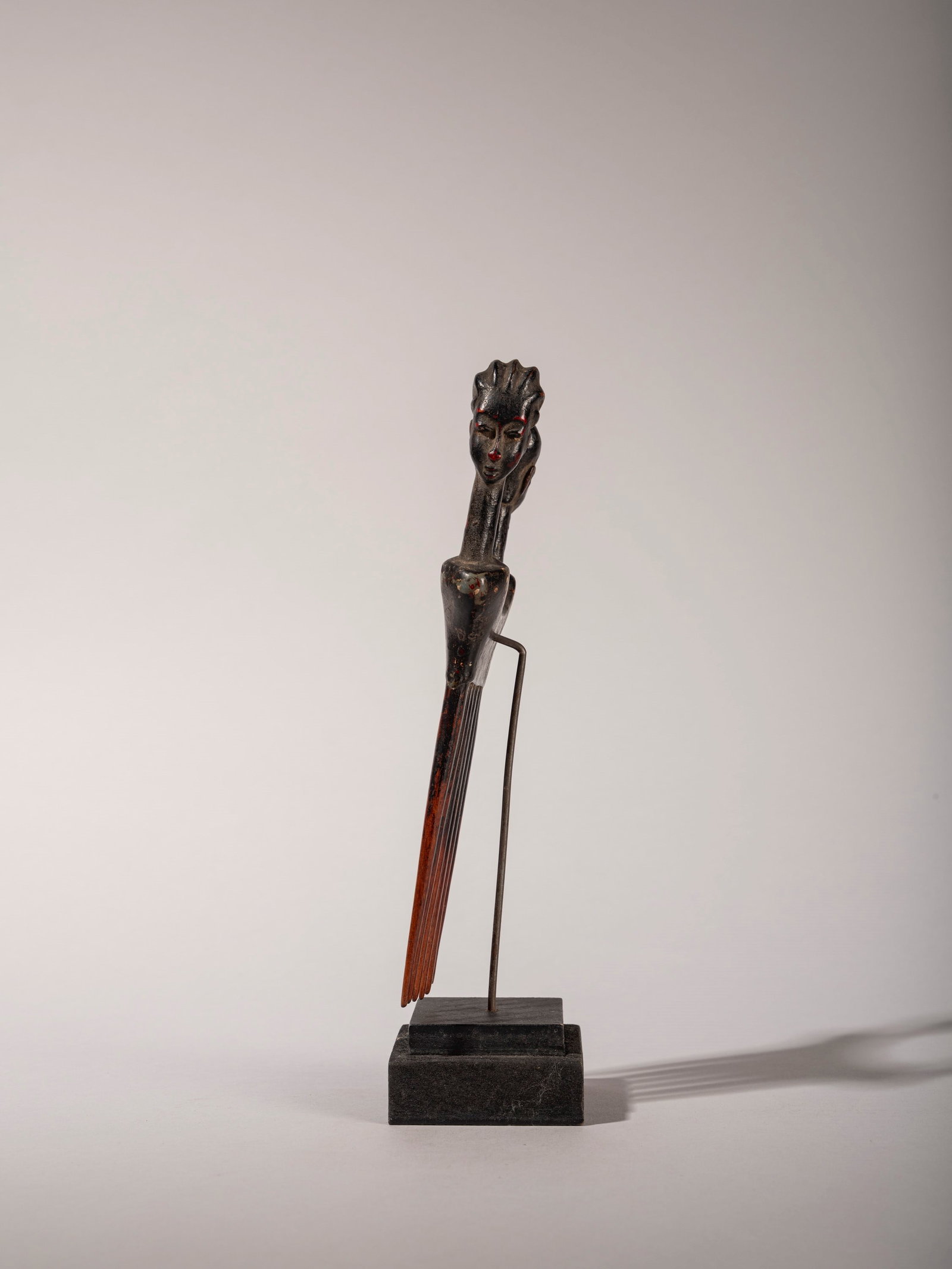 CEREMONIAL COMB, Baule, Ivory Coast, mid-20th century: h cm 20 Made of wood, with two carved faces one male and one female at the top