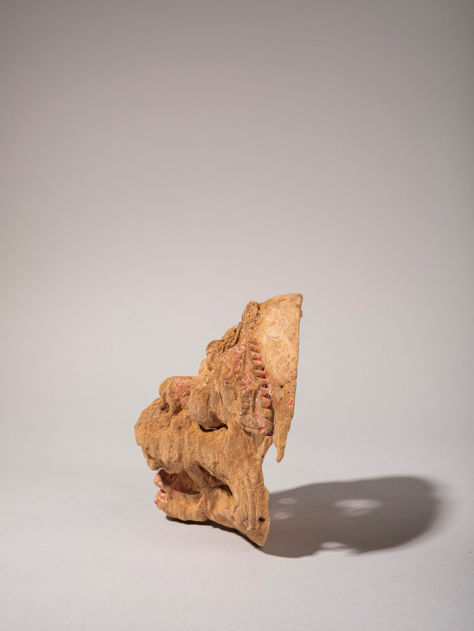 CARVED WOODEN MASK DEPICTING A HUMAN FIGURE, Bali, first half of the 20th century: l cm 13 x h cm 17 Bali, first half of the 20th century