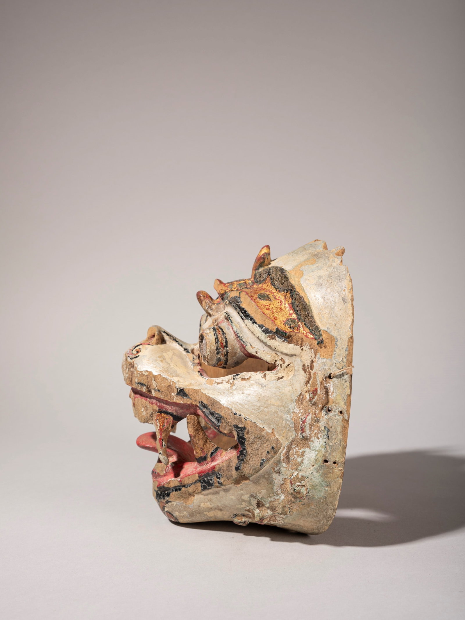 HANUMAN MASK, Bali, 20th century: l cm 15 x h cm 19 Made of carved and painted wood and embellished with polychrome glass inlays